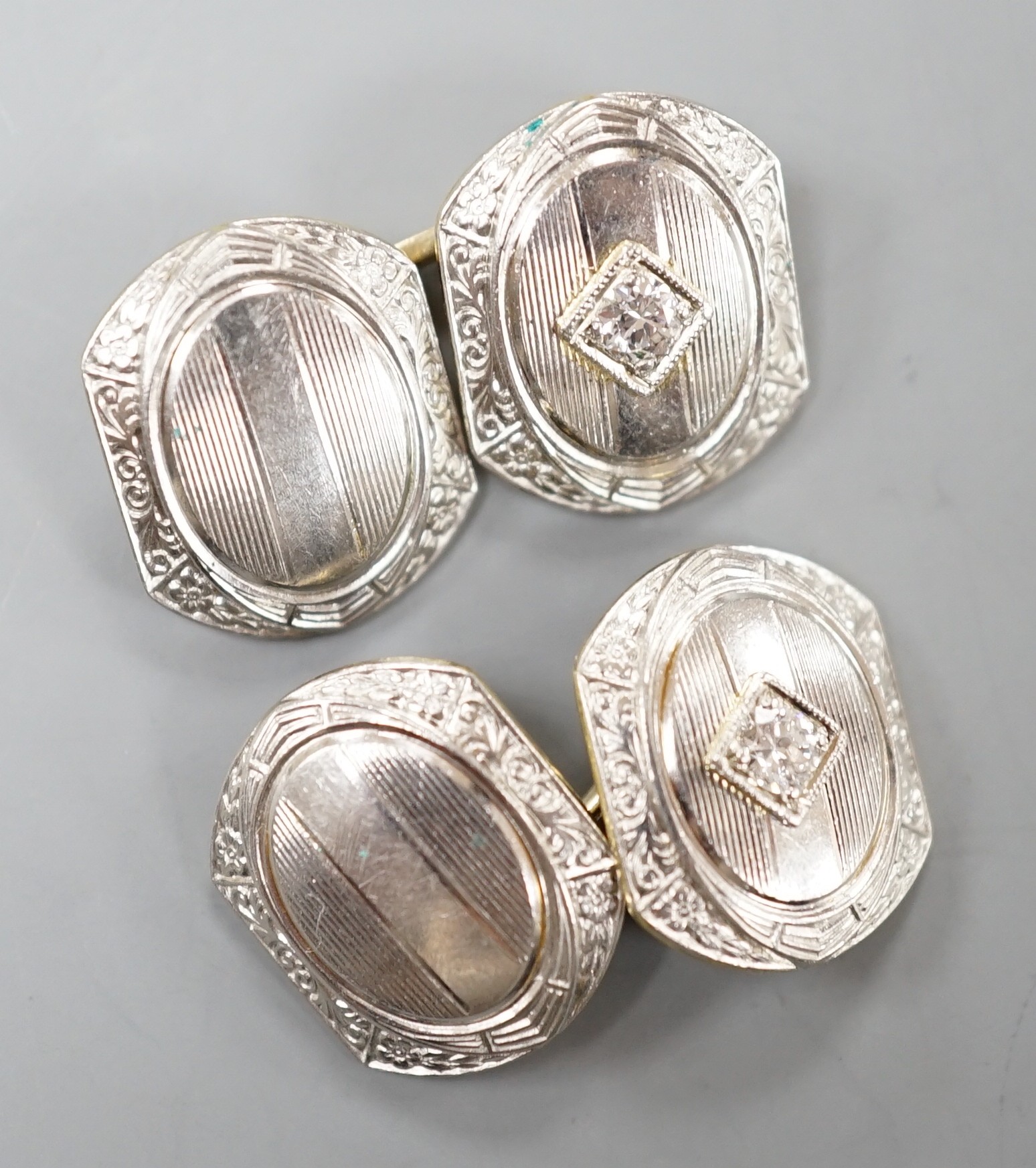A pair of two colour 14k and diamond set shaped hexagonal cufflinks, 13mm, 9.6 grams.